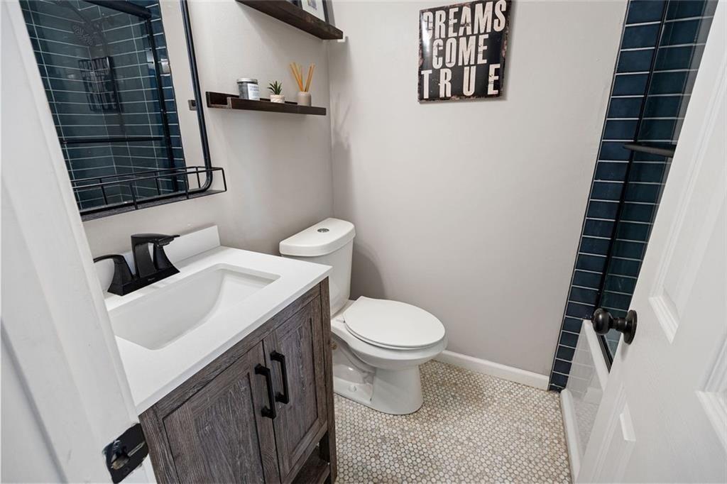 140 Mt Tabor Court Dallas, GA 30157 - Photo 19 of 32 a bathroom with a sink and a toilet