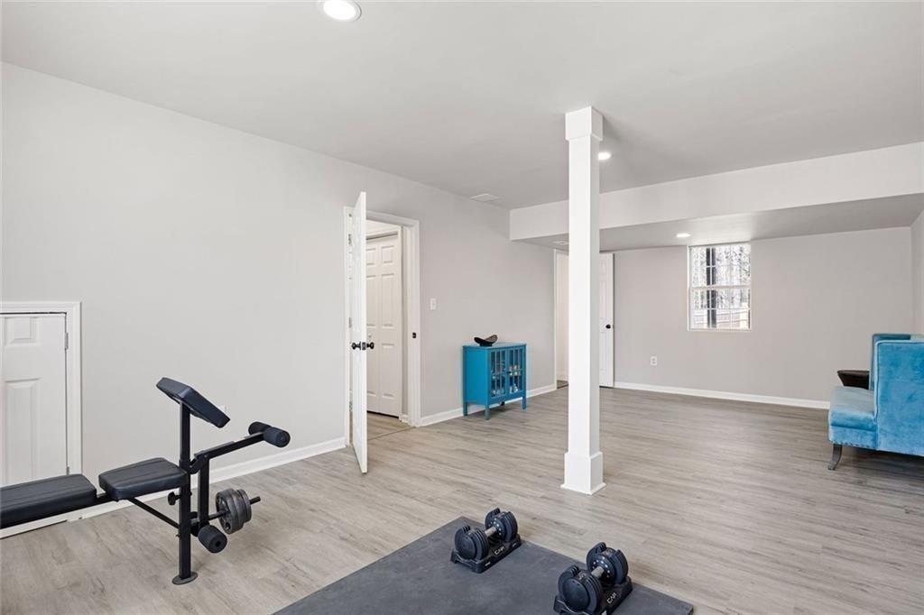 140 Mt Tabor Court Dallas, GA 30157 - Photo 22 of 32 a view of a room with gym equipment and windows