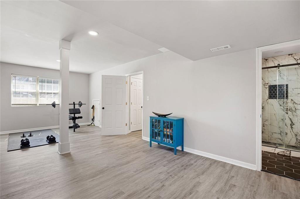 140 Mt Tabor Court Dallas, GA 30157 - Photo 23 of 32 a view of an empty room with wooden floor and a window