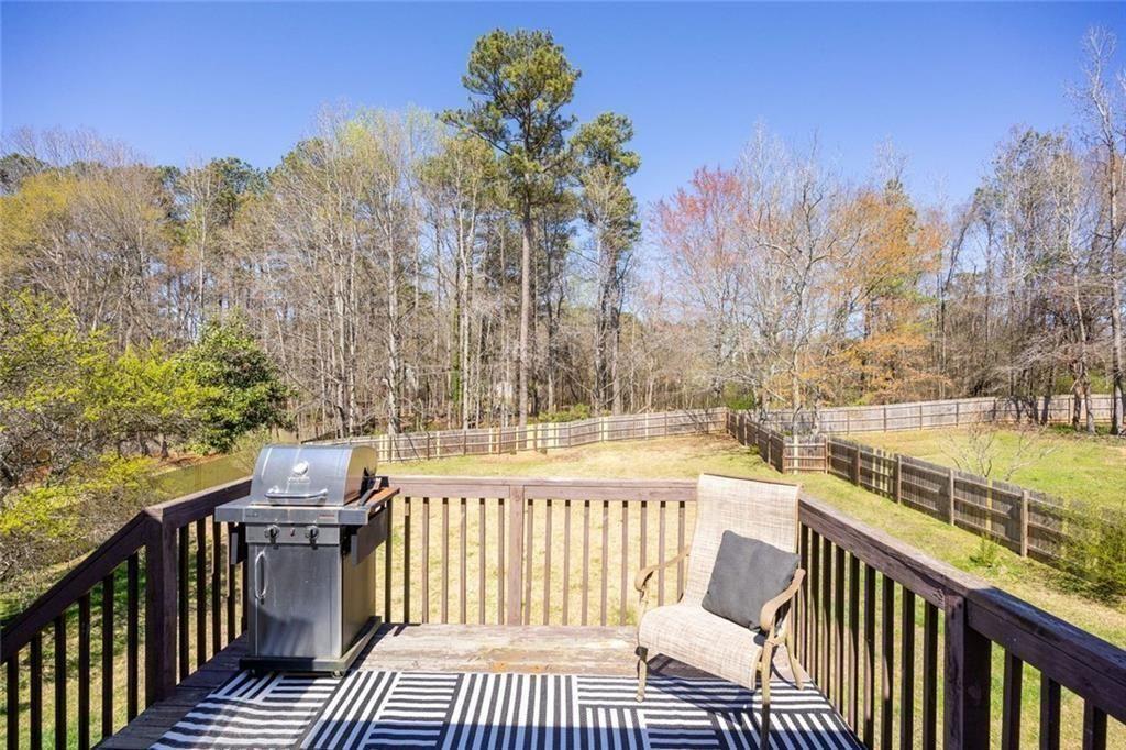 140 Mt Tabor Court Dallas, GA 30157 - Photo 26 of 32 a view of a balcony with wooden floor and fence