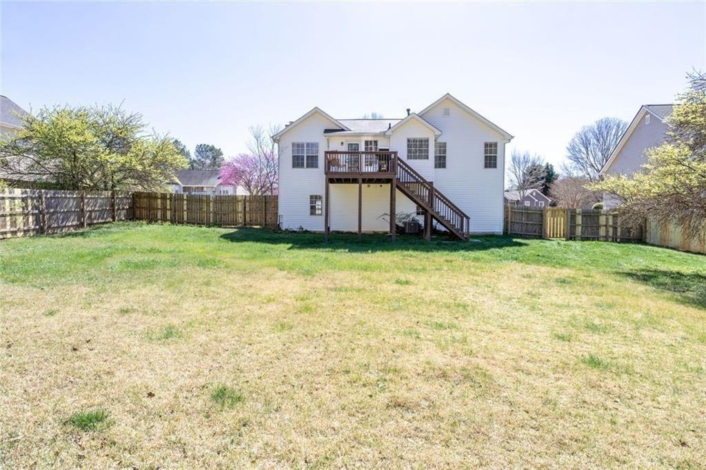 140 Mt Tabor Court Dallas, GA 30157 - Photo 28 of 32 a view of a house with a yard and deck