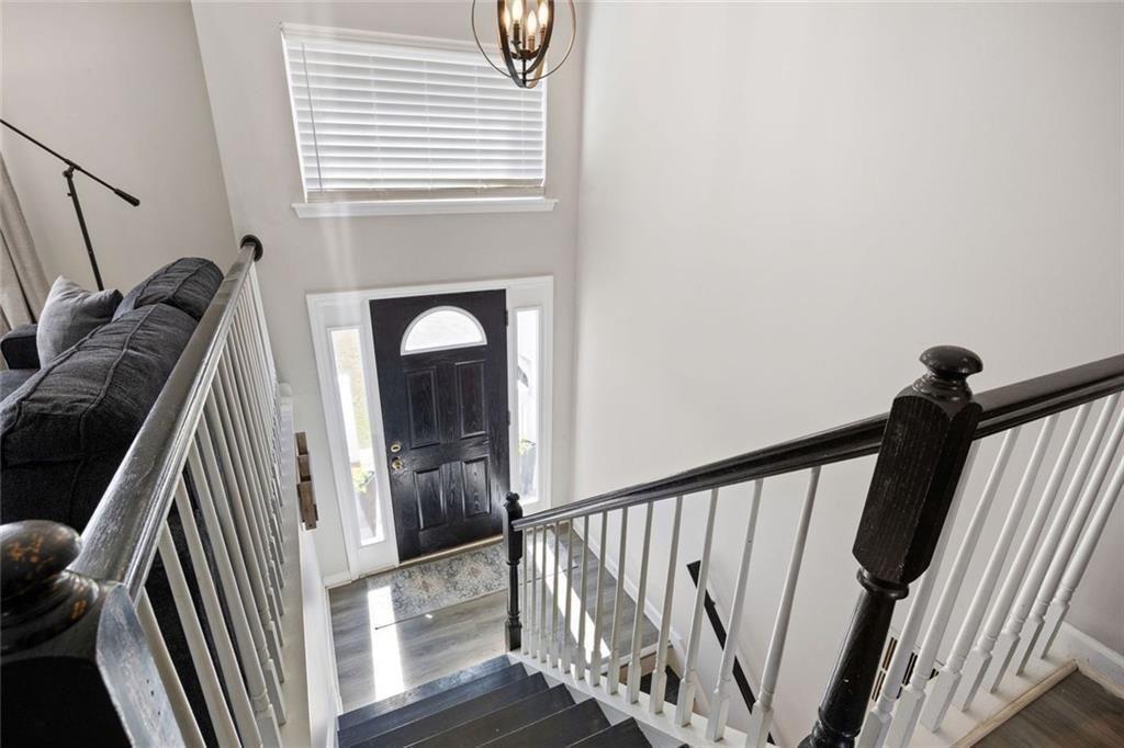 140 Mt Tabor Court Dallas, GA 30157 - Photo 4 of 32 a view of a staircase with wooden floor and a window