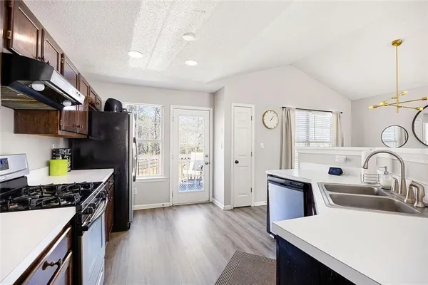 a view of a dining room with furniture window and wooden floor