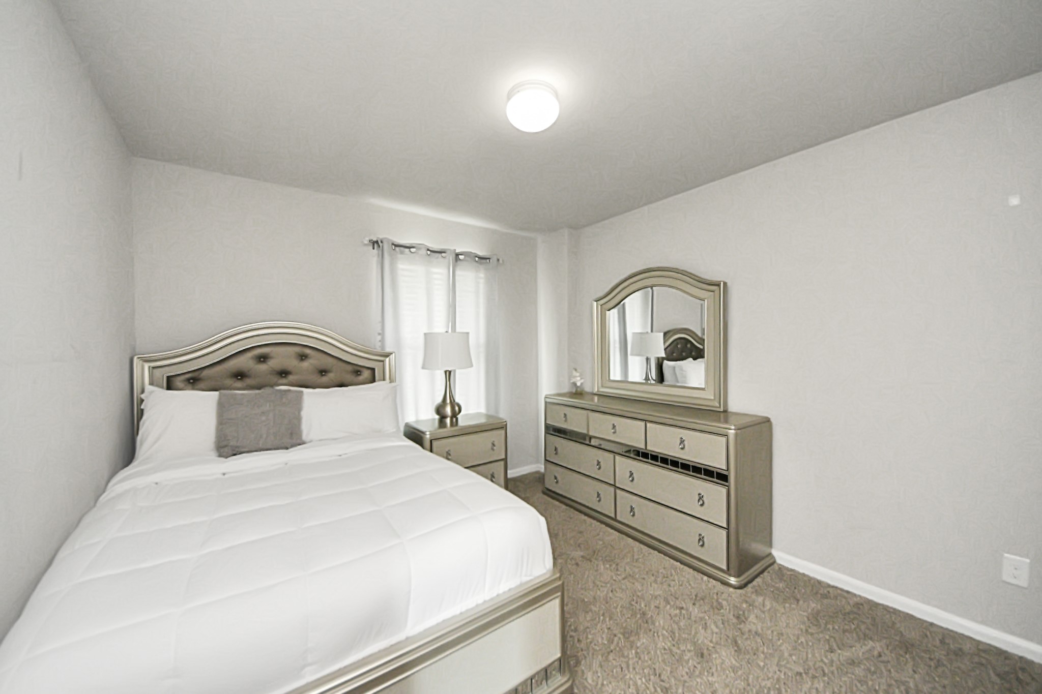 3514 Windham Way Katy, TX 77494 - Photo 11 of 42 a bedroom with a bed and a dresser