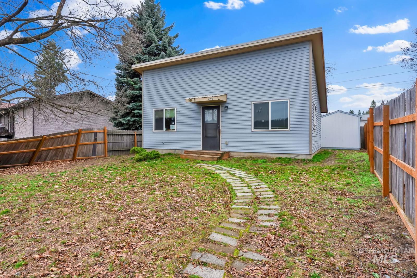 4715 West Reeves Street Coeur D'Alene, ID 83814 - Photo 3 of 24 Rear view of property featuring a fenced backyard