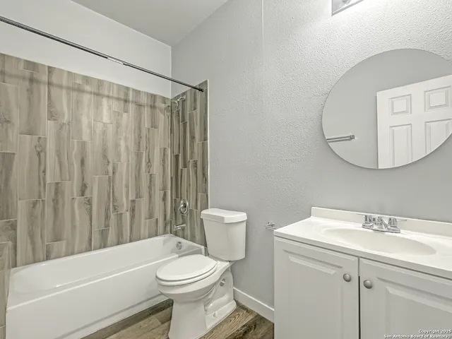 a bathroom with a sink a toilet and a bathtub