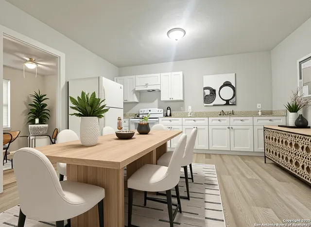 a dining room with furniture and window