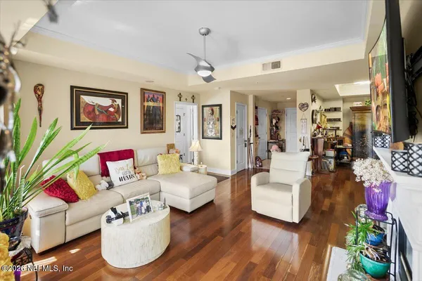 a living room with furniture or couch and a flat screen tv