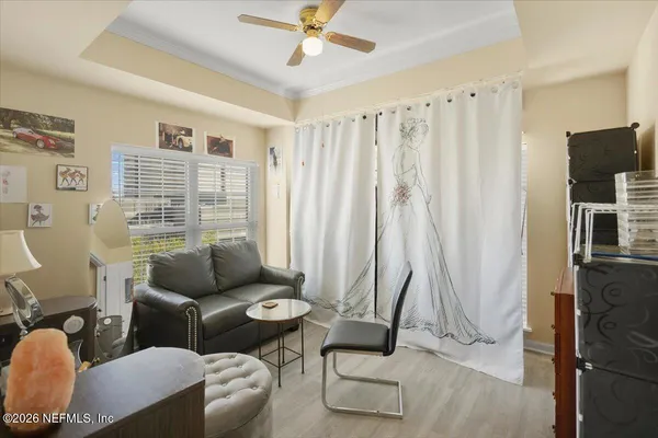 a bedroom with furniture and a chandelier