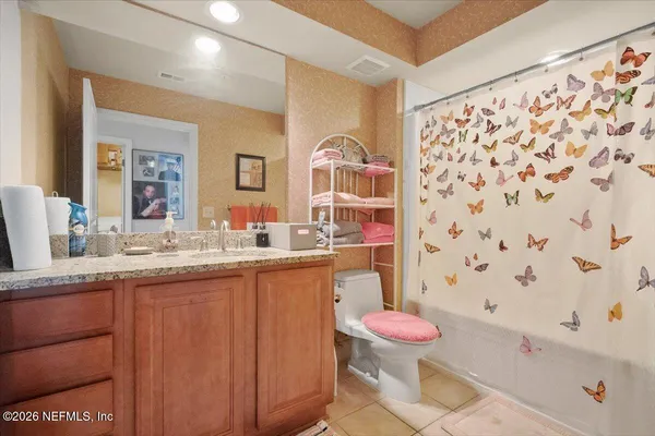 a bedroom with a bed and a walk in closet