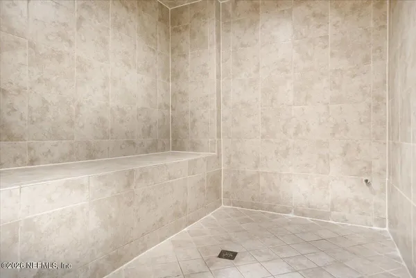 a living room with furniture a fireplace and windows