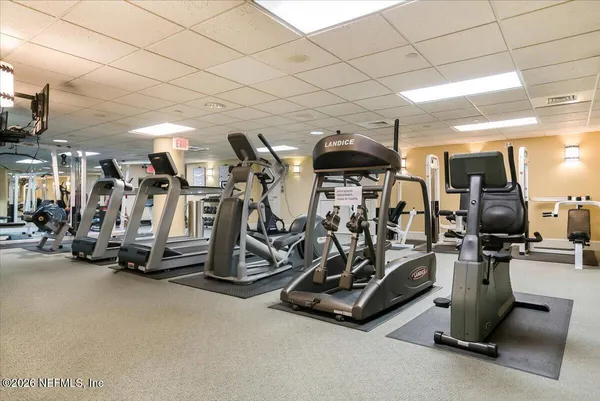 a view of a house with swimming pool and sitting area