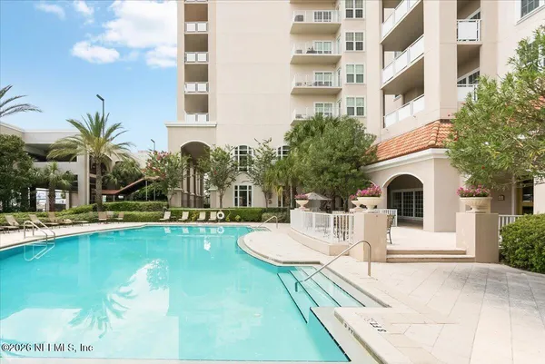a view of a dining room with furniture and a window