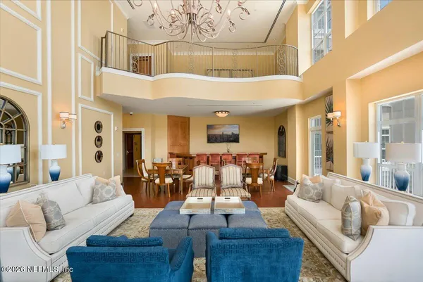 a living room filled with furniture and a potted plant