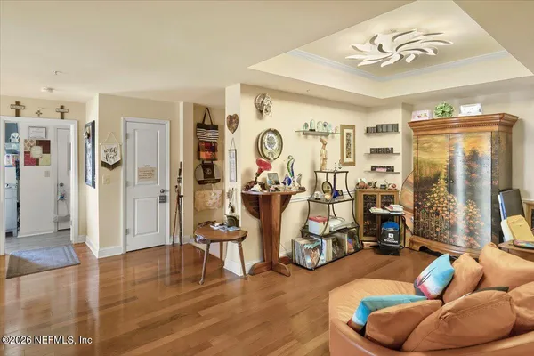 a view of a livingroom with furniture and a large window