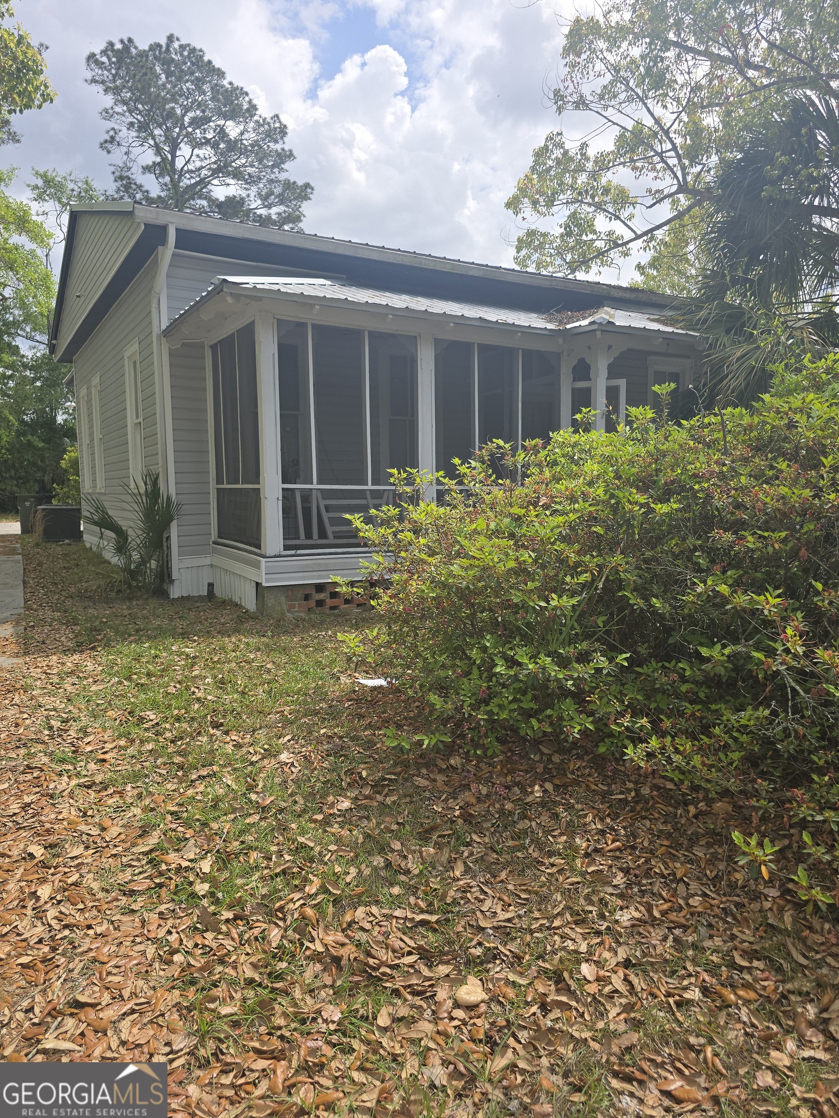 1500 Clough Street Waycross, GA 31501 - Photo 2 of 12 a house with garden in front of it
