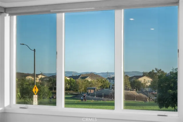 a view of a glass door and a window