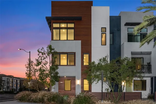 a front view of a house with trees