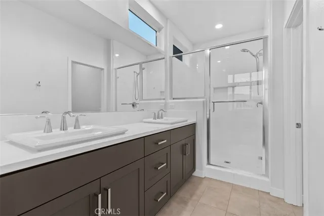 a bathroom with a double vanity sink mirror and double