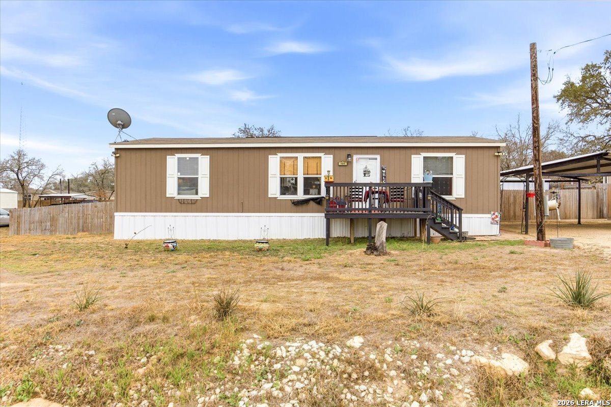 101 Rocky Ridge Drive Poteet, TX 78065 - Photo 1 of 36 a house view with swimming pool and porch