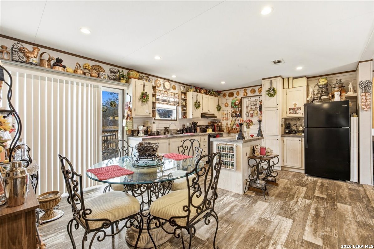 101 Rocky Ridge Drive Poteet, TX 78065 - Photo 17 of 36 a dining room with furniture and a floor to ceiling window