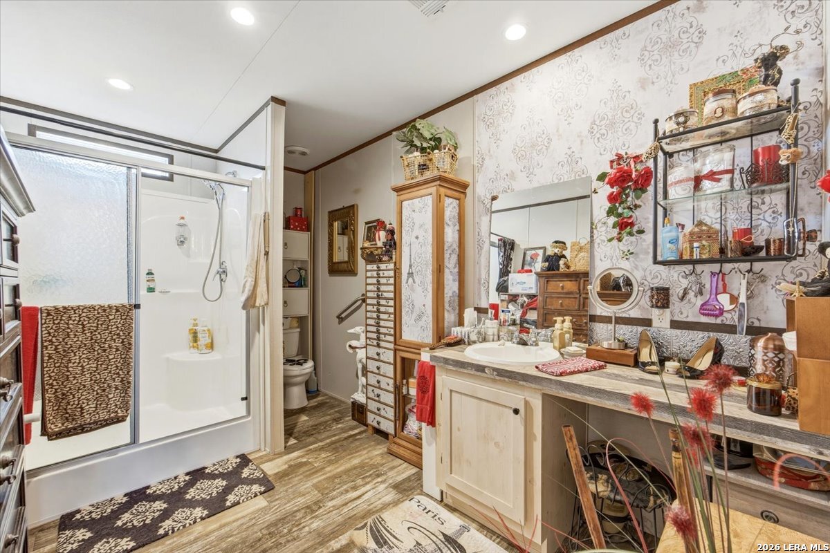 101 Rocky Ridge Drive Poteet, TX 78065 - Photo 20 of 36 a view of a bedroom with furniture and window