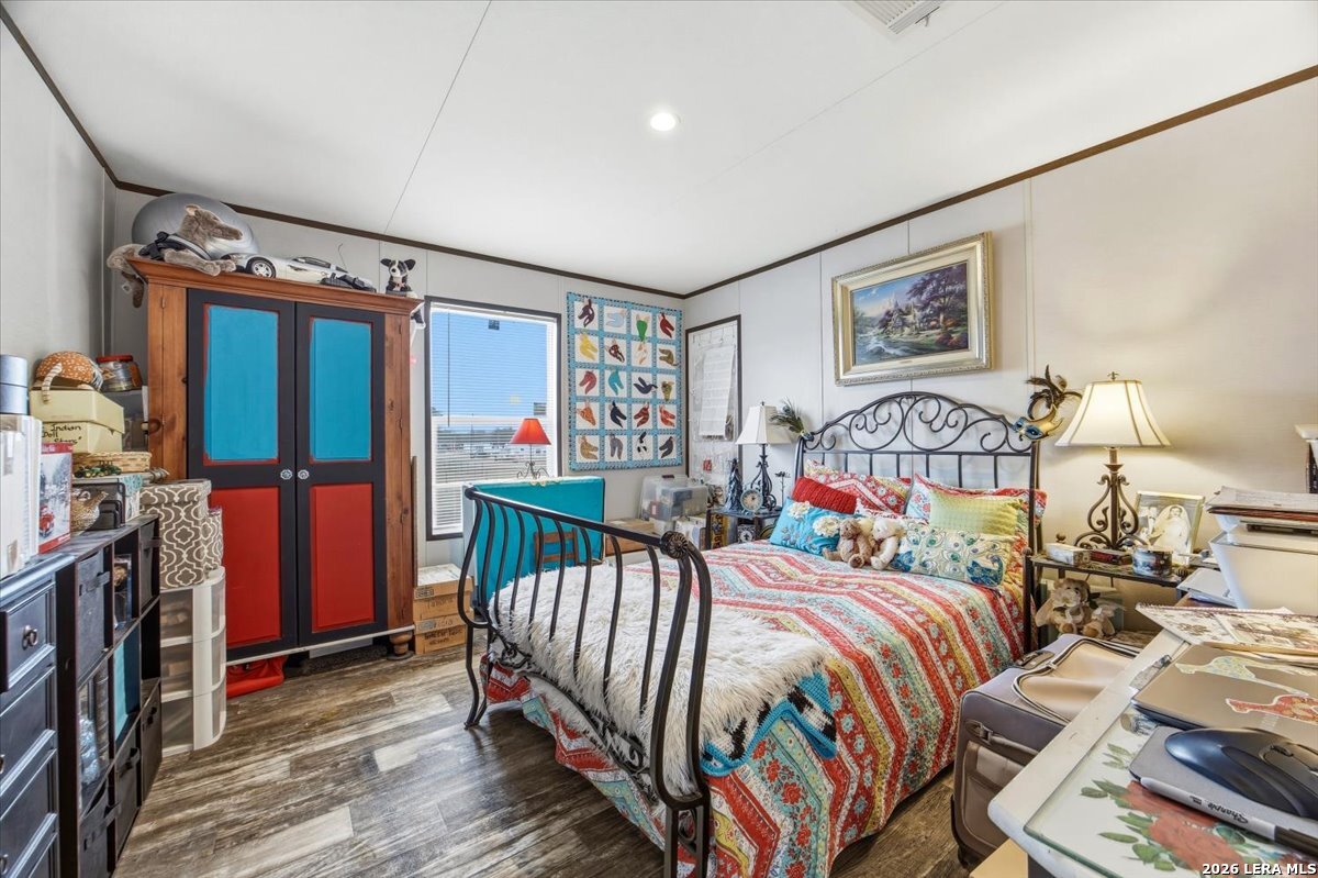 101 Rocky Ridge Drive Poteet, TX 78065 - Photo 22 of 36 a bedroom with two beds and a desk