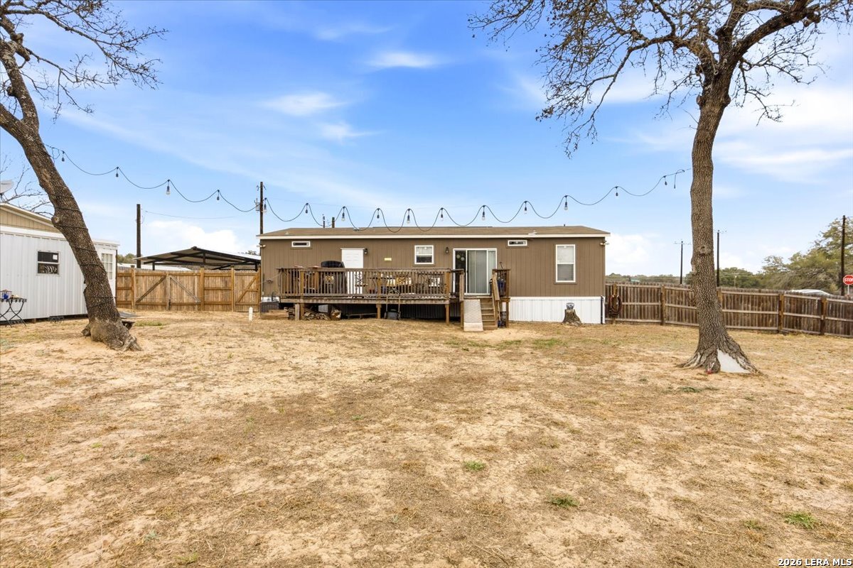 101 Rocky Ridge Drive Poteet, TX 78065 - Photo 31 of 36 a view of a house with a patio