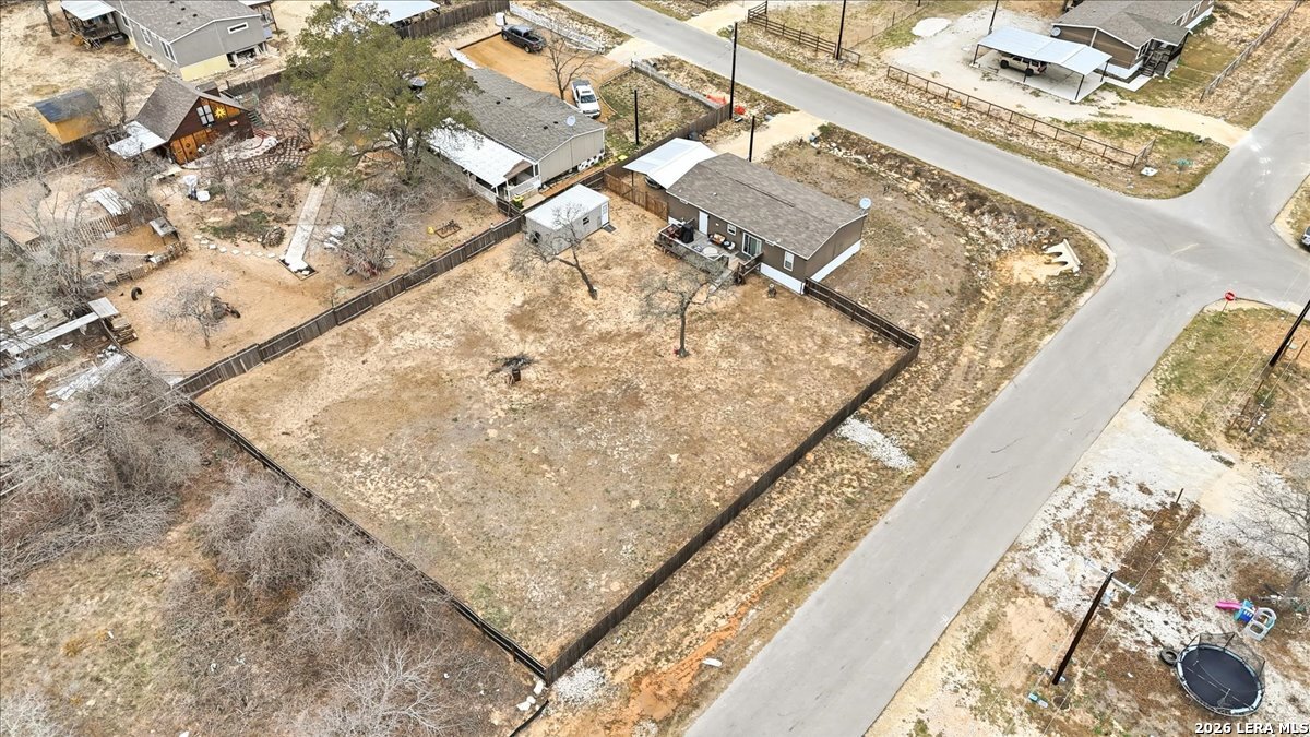 101 Rocky Ridge Drive Poteet, TX 78065 - Photo 36 of 36 a bed with white sheets and a blanket