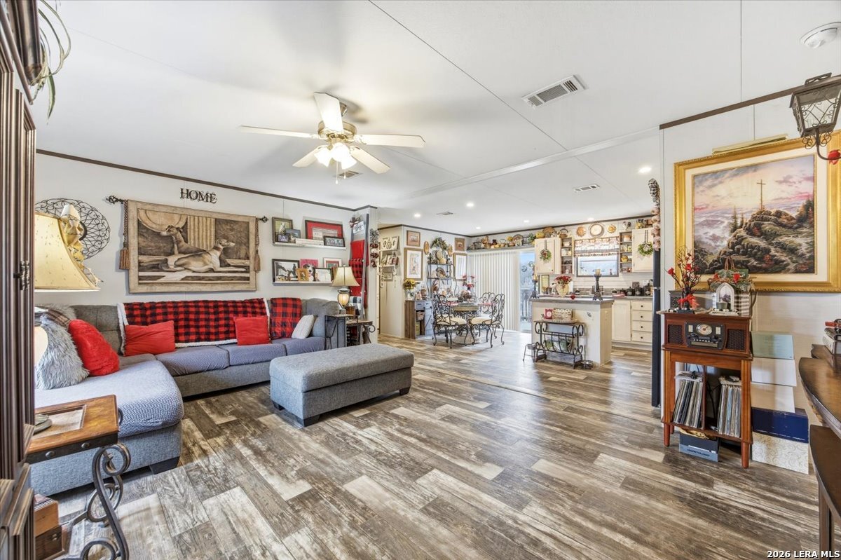 101 Rocky Ridge Drive Poteet, TX 78065 - Photo 6 of 36 a living room with furniture and a flat screen tv