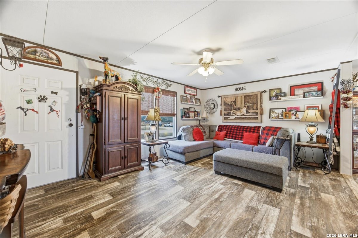 101 Rocky Ridge Drive Poteet, TX 78065 - Photo 8 of 36 a living room with furniture and a ceiling fan