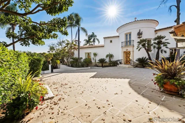 a view of a parking space in front of a house