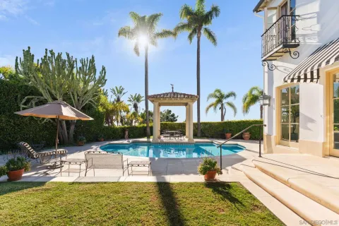 a view of a swimming pool with a patio