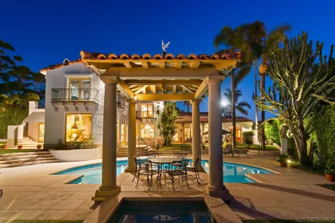 a view of a patio with table and chairs and potted plants