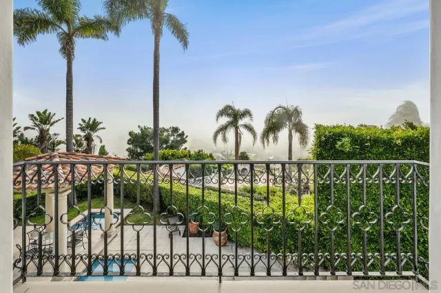 a living room with furniture and a kitchen
