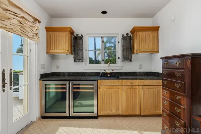a spacious bathroom with a double vanity sink and a mirror