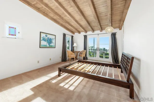 a view of a patio with table and chairs potted plants and a large tree