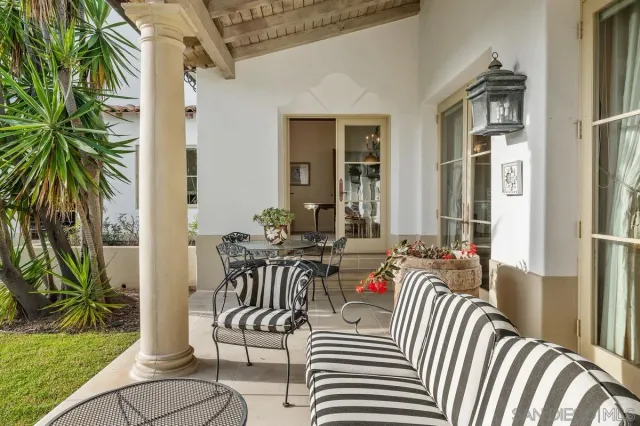 a view of a swimming pool with a outdoor seating