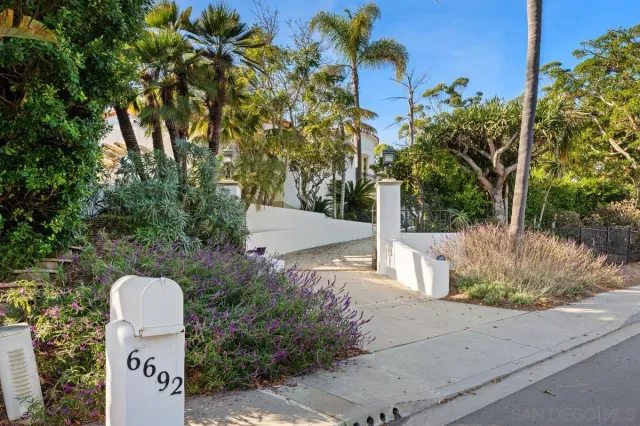 a view of a tree in front of a house
