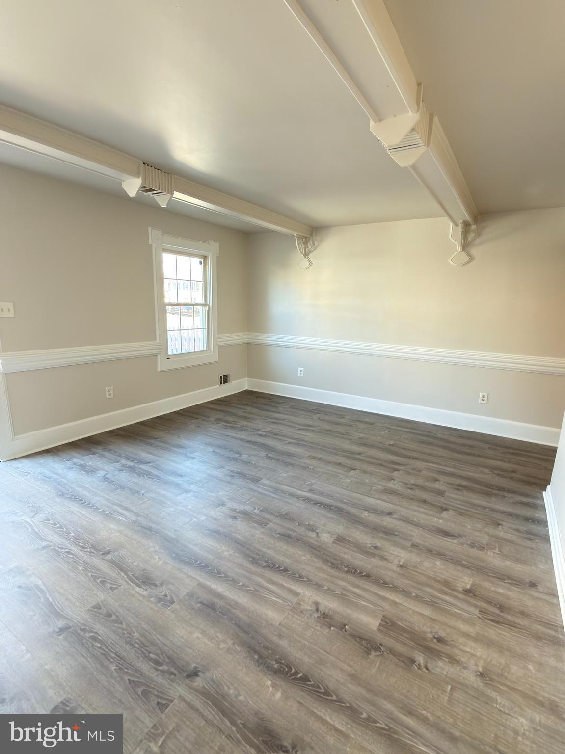 9203 Hood Road Manassas, VA 20110 - Photo 3 of 23 wooden floor in an empty room with a window