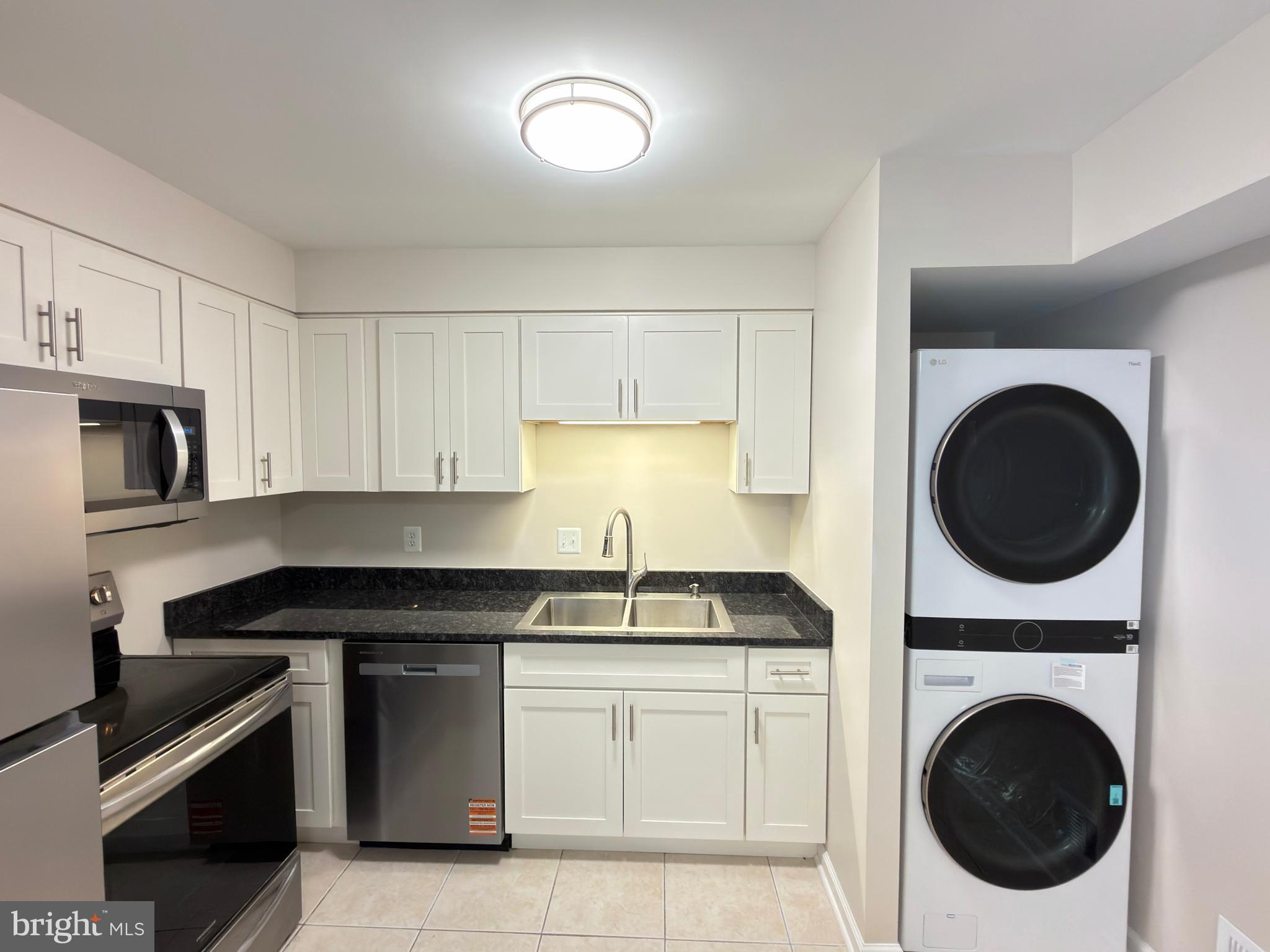 9203 Hood Road Manassas, VA 20110 - Photo 7 of 23 a kitchen with a sink and a stove top oven