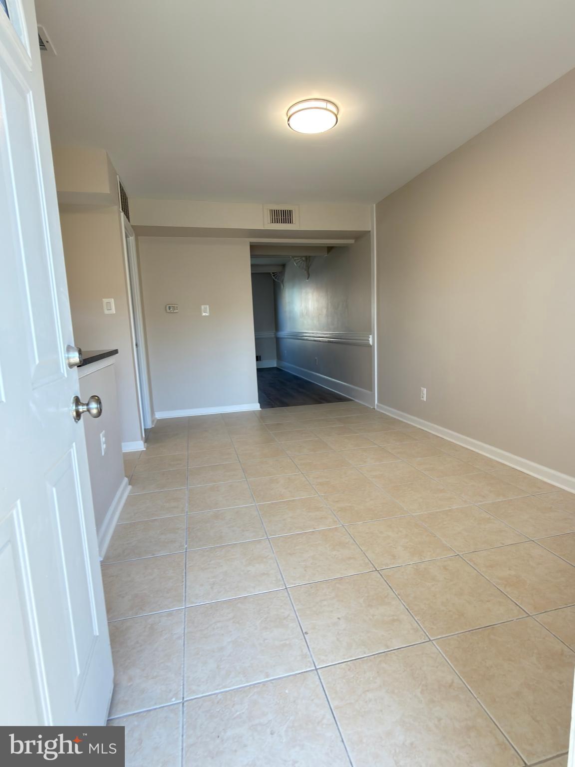 9203 Hood Road Manassas, VA 20110 - Photo 9 of 23 a view of an empty room with a fireplace