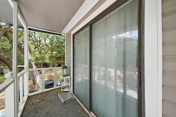 a view of a glass door and porch