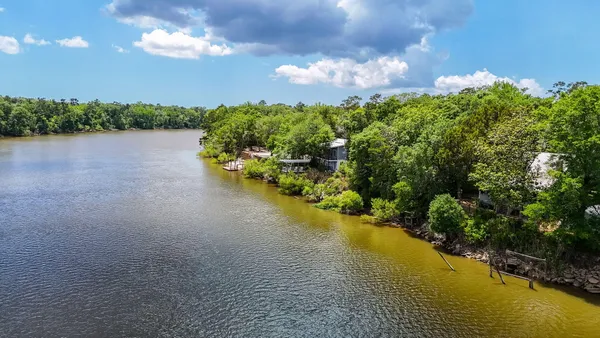 a view of a lake in middle of forest