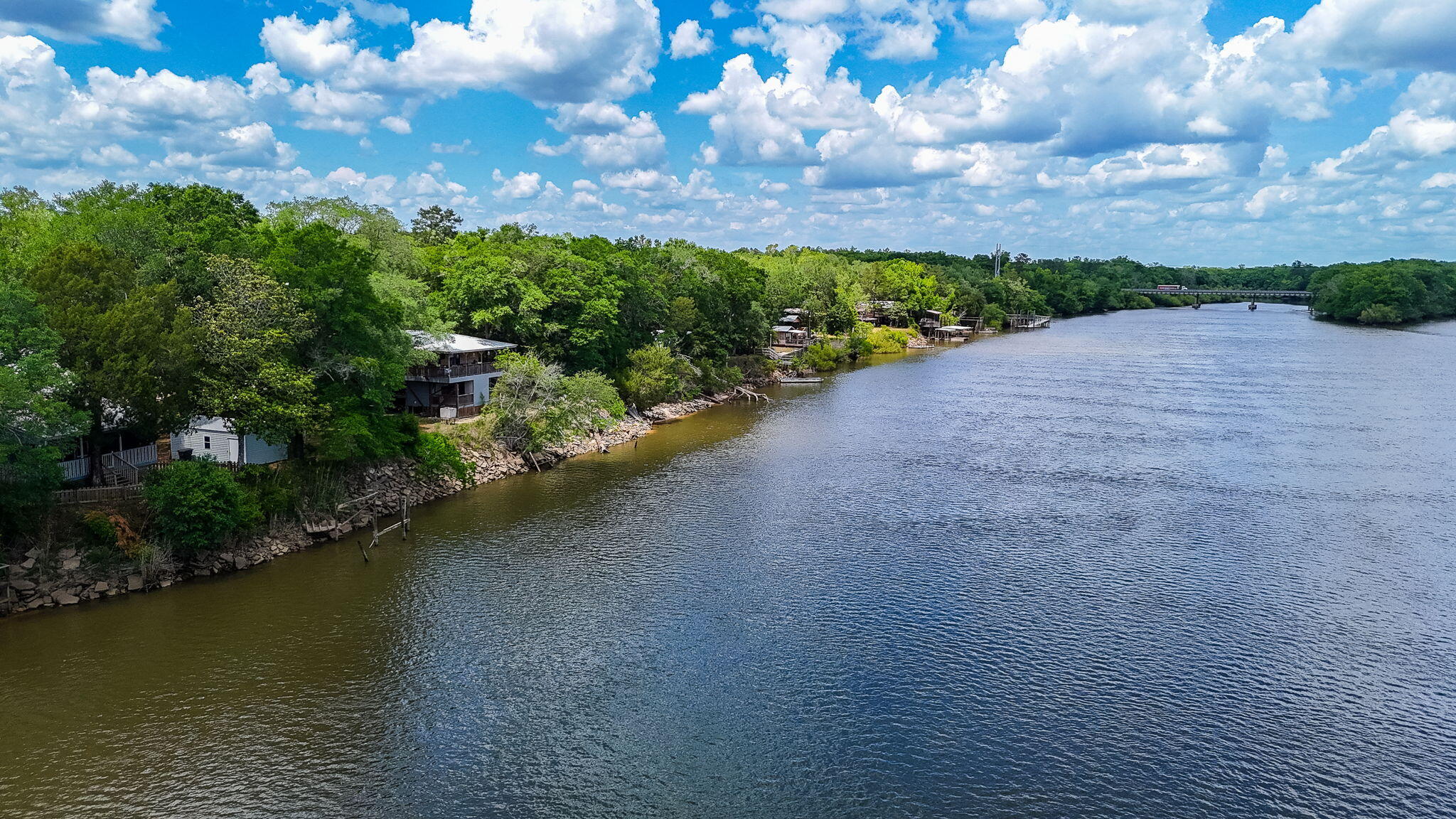 439 Big Cedar Road Ponce de Leon, FL 32455 - Photo 16 of 48 a view of a lake with houses in back