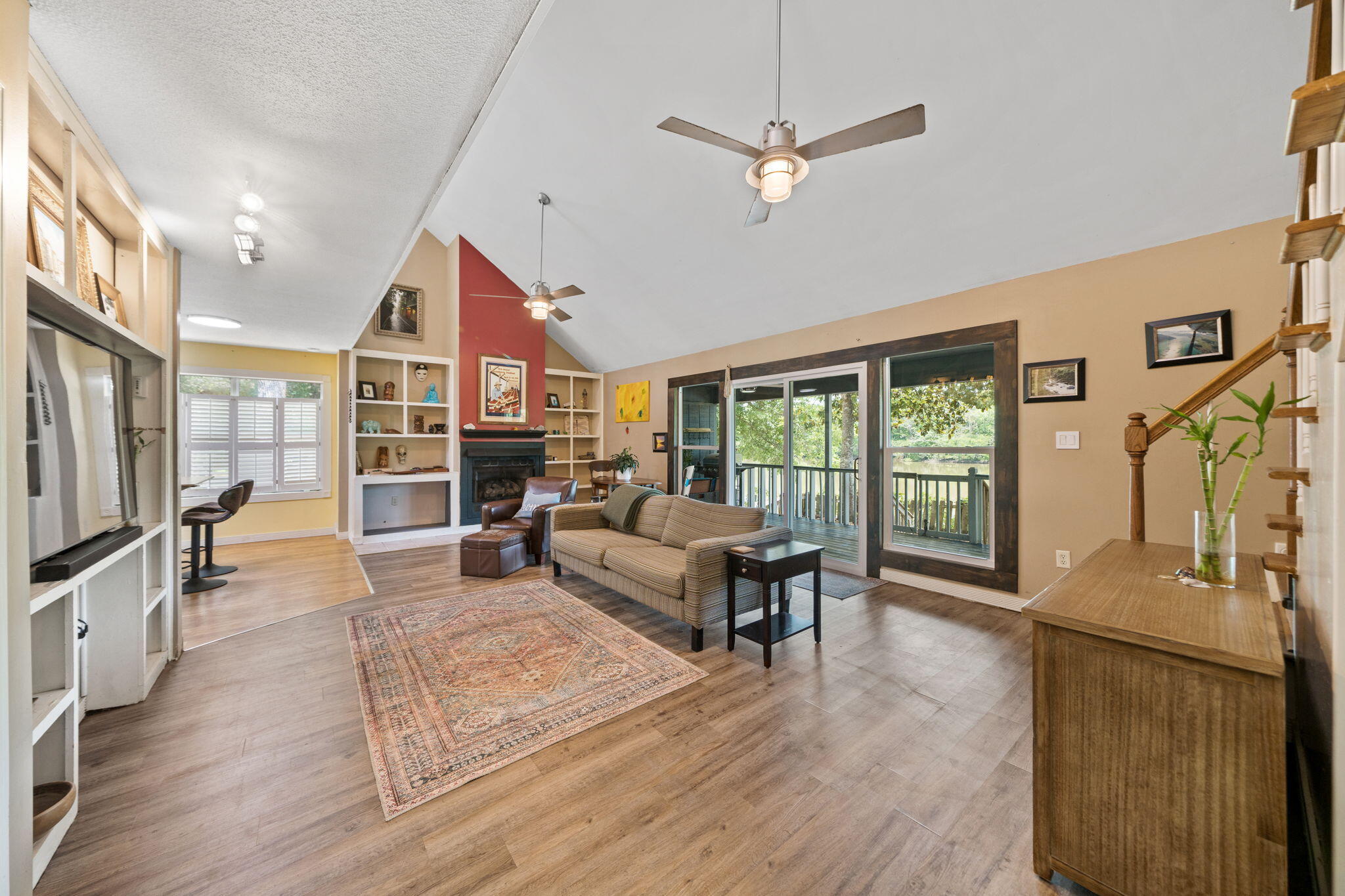 439 Big Cedar Road Ponce de Leon, FL 32455 - Photo 23 of 48 a living room with furniture a fireplace and a flat screen tv