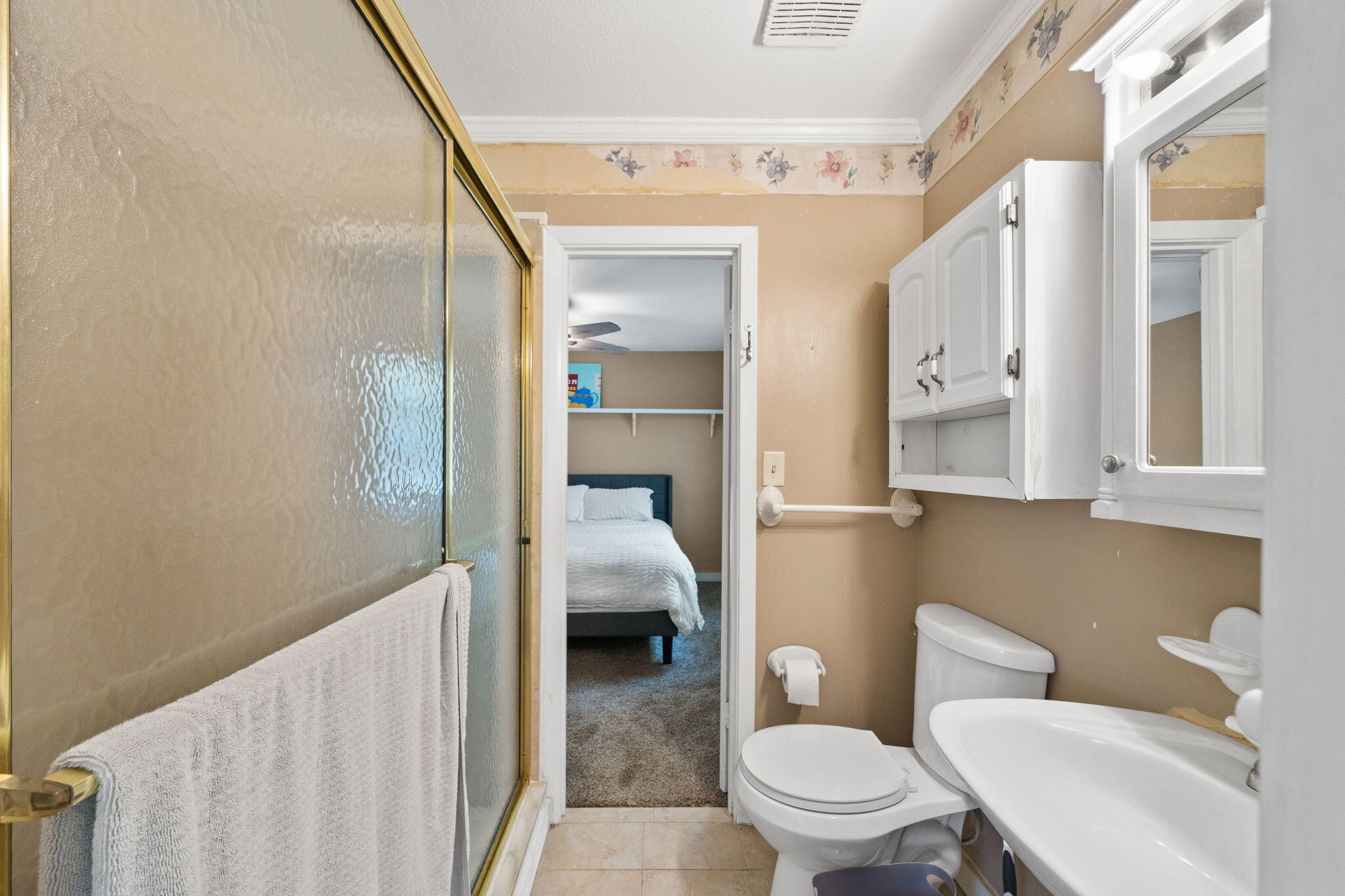 439 Big Cedar Road Ponce de Leon, FL 32455 - Photo 30 of 48 a bathroom with a toilet sink and a mirror