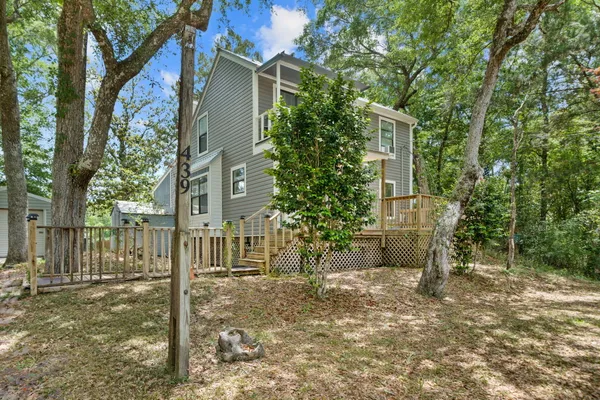 front view of a house with a tree