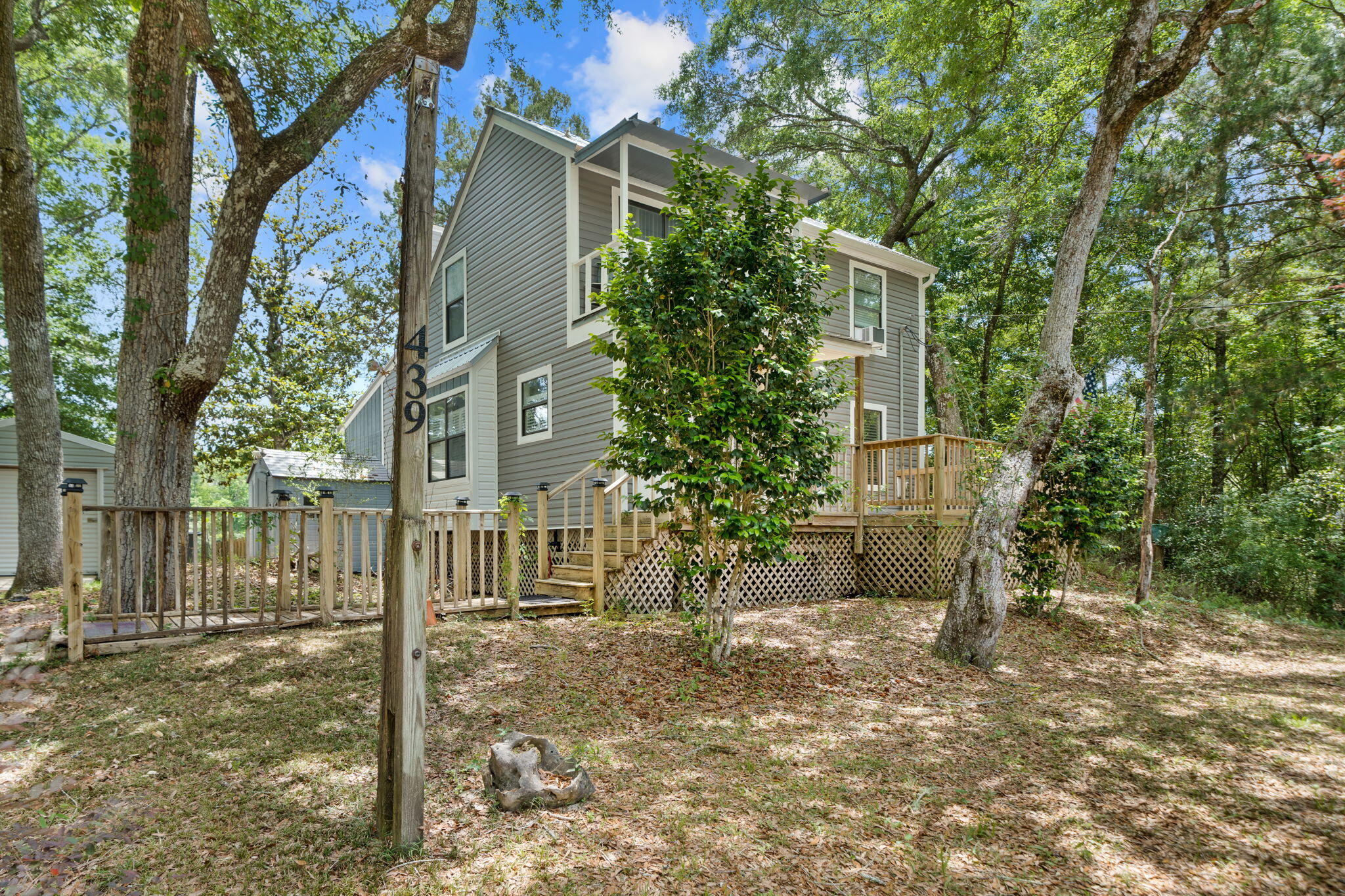439 Big Cedar Road Ponce de Leon, FL 32455 - Photo 3 of 48 front view of a house with a tree