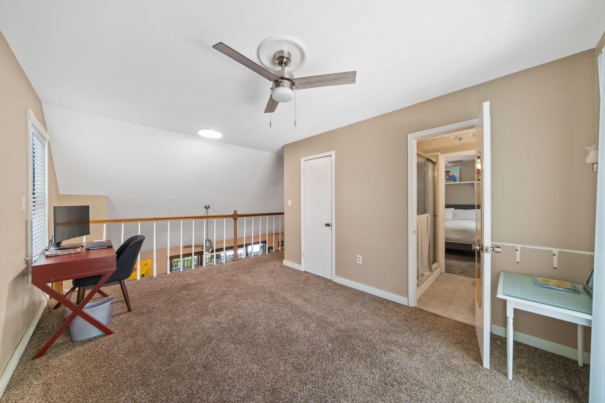 439 Big Cedar Road Ponce de Leon, FL 32455 - Photo 31 of 48 a view of a hallway with furniture and a ceiling fan